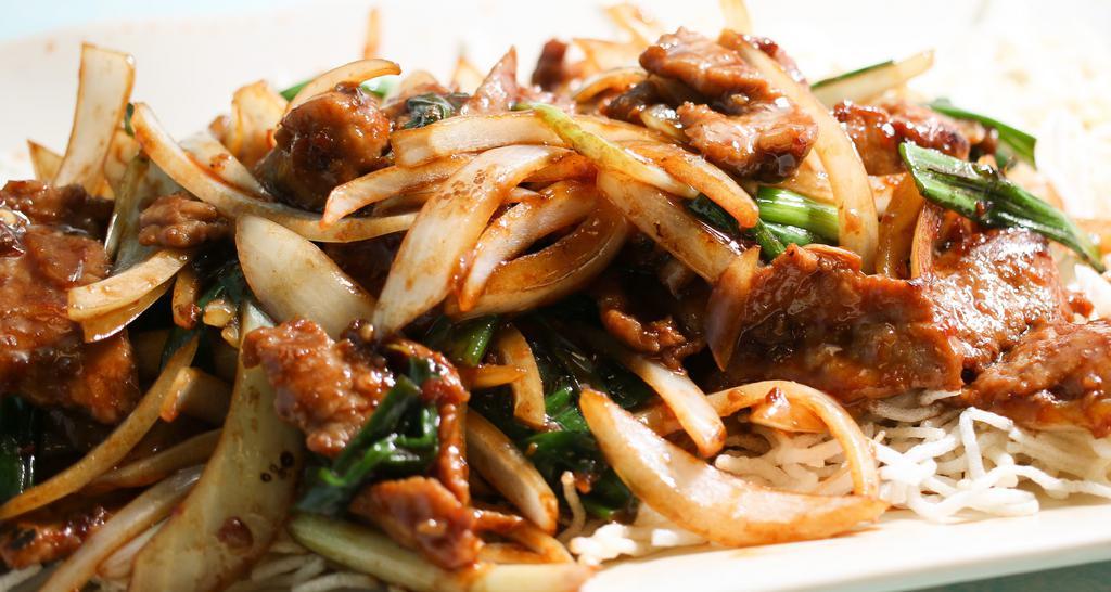 Spicy Mongolian Beef · Hot and spicy. Tender sliced beef with green and white onions stir-fried in a spicy Mongolian sauce.