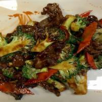 Beef & Broccoli · Tender sliced beef with broccoli and carrots stir-fried in brown sauce.
