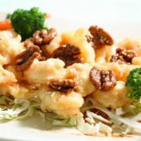 Honey Walnut Shrimp · Crispy breaded shrimp topped with walnuts and side of creamy mayonnaise sauce.