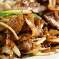 Dry Beef Chow Fun · White flat rice noodle with bean sprouts and onions and stir-fried in soy sauce.