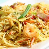  Singapore Rice Noodles · Hot and spicy. Thin rice noodle with shrimp, BBQ pork, eggs, onions and carrots wok stir-fri...