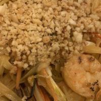 Pad Thai · Thin Thai rice noodles with eggs, carrots, onions and bean sprouts stir-fried in fish sauce ...