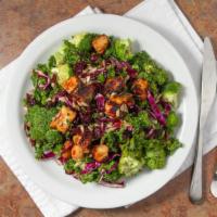 Broccoli Kale Salad · Chopped kale, red cabbage and broccoli tossed with a honey dijon dressing, topped with dried...