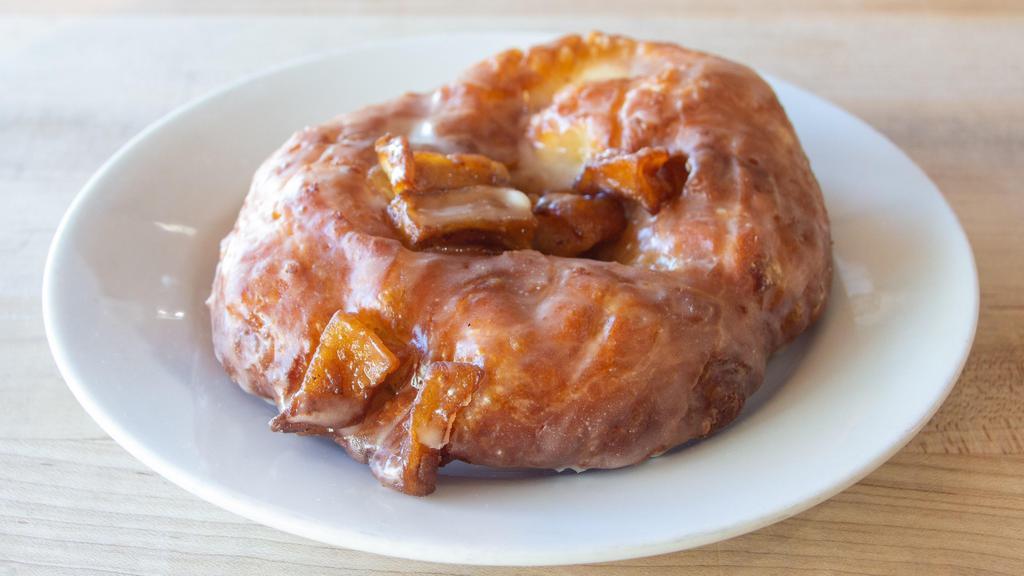Classic Apple Fritter · Fluffy, yeast-raised fritter filled with granny smith apples and topped with a cinnamon-spiced apple glaze.