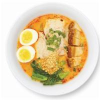 Ba-Mhee Tom-Yum · Egg noodle in spicy hot and sour soup, with five spice pork loin, crispy pork belly, whole s...