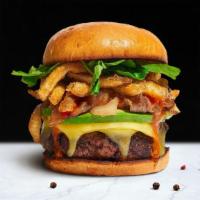 The Big Burger · American beef patty topped with fries, avocado, swiss cheese, caramelized onions, ketchup, a...