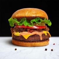 Classic Bottom Burger · American beef patty topped with lettuce, tomato, onion, and pickles. Served on a griddled br...