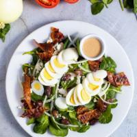Bobby Cobb Salad · Romaine hearts, blue cheese, bacon, hard-boiled pastured egg, avocado, and tomato tossed wit...