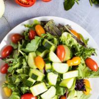 Greenhouse Salad  · Romaine lettuce, cherry tomatoes, carrots, and onions dressed tossed with lemon juice & oliv...