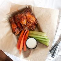 Traditional Wings (Bone-In) · 1 lb with your choice of sauce. 

Sauces: House rub, chipotle BBQ, Teriyaki, Tamarind Habane...