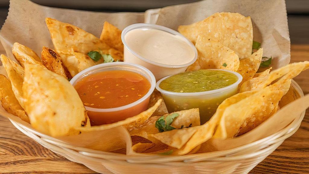 Chips Two Ways 'N Salsa Trio (Vegetarian) · Freshly fried corn AND flour tortilla chips served with a trio of our tomatillo, arbol, and chipotle lime crema salsas
