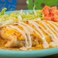 Smothered Spicy Chile Verde Burrito · Braised Pork in a Chile Verde Sauce with Rice and Refried Black Beans Wrapped in a Flour Tor...