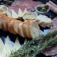 Netflix & Chill Charcuterie & Cheese Package · Prosciutto, Coppa, Whiskey Salame, Manchego, Toma, Triple Cream. Sides, mustards, breads, co...