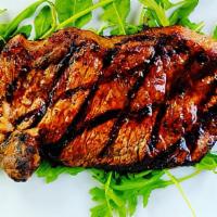 Classic New York Steak Dinner · Marinated, center cut, grilled, tender, New York strip steak, served with a choice of  veget...