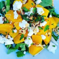 Golden Beet Salad · Sweet golden beets tossed with wild arugula, chopped asparagus, sliced shallots, toasted wal...
