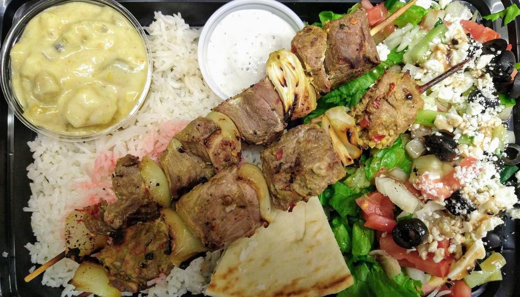 Lamb Kabob Plate - Regular Price · Two Skewers of Lamb Kabob Served with Basmati rice, Pita, Tzatziki Sauce and Choice of Side (Can be Made Dairy Free and Gluten Free Upon Request)