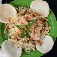 Green Papaya Salad · Hand cut green papaya, carrots, and mint. Topped with shrimp and served with shrimp crackers...