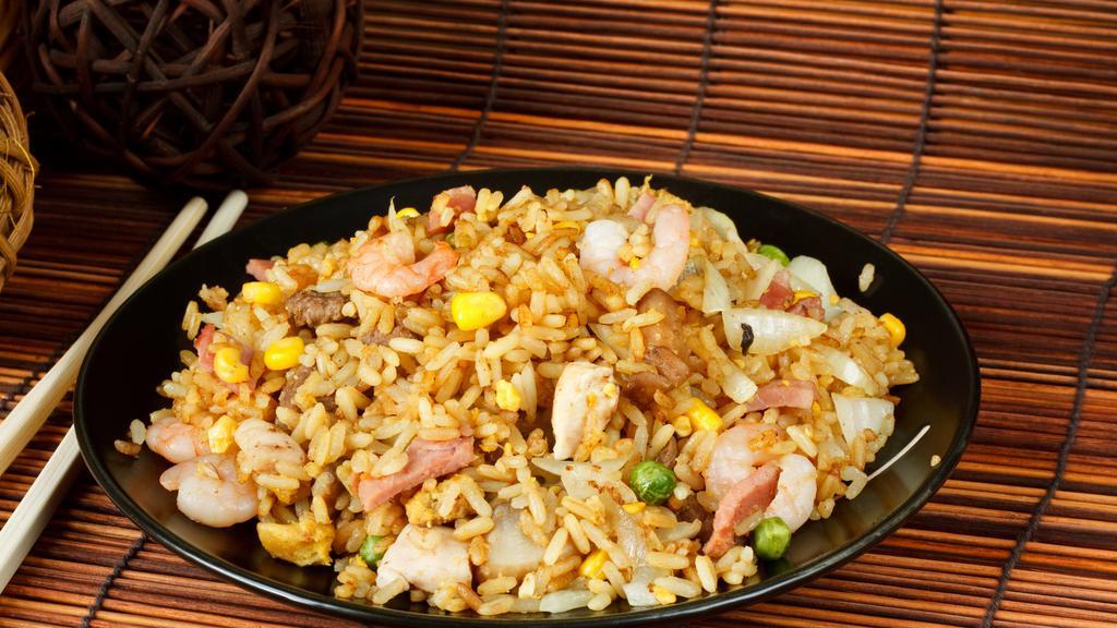 The House Fried Rice · Traditional fried rice stir-fried and loaded with tender beef, seasoned chicken, and shrimp with eggs and fresh vegetables.