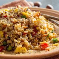 The Vegetable Fried Rice · Traditional dish of steamed rice stir-fried with soy sauce, egg and fresh vegetables.