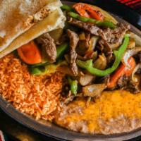 Beef Fajita Din · Marinated Beef grilled with sliced onions, bell peppers, and tomato wedges. Served with sour...