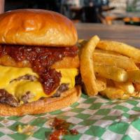 Western Bbq Burger  · Double patty, cheese, bacon, onion rings & BBQ on a toasted brioche bun.
