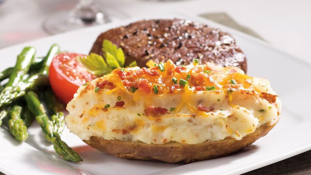 Twice Baked Potato · Idaho potato filled with creamy potatoes mixed with bacon and cheddar cheese, sour cream, and butter.