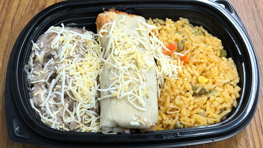 Beef Tamale Meal · Beef tamale with re-fried beans and rice topped with cheddar cheese.