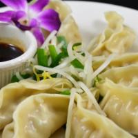 Steamed Dumpling (Vg) · Steamed dumpling stuffed w/ vegetables, served w/ bean sprout, chive and Thai style soy ging...