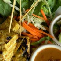 Tofu Satay: · Skewers of grilled, tofu marinated in a light curry served with peanut sauce, and cucumber s...