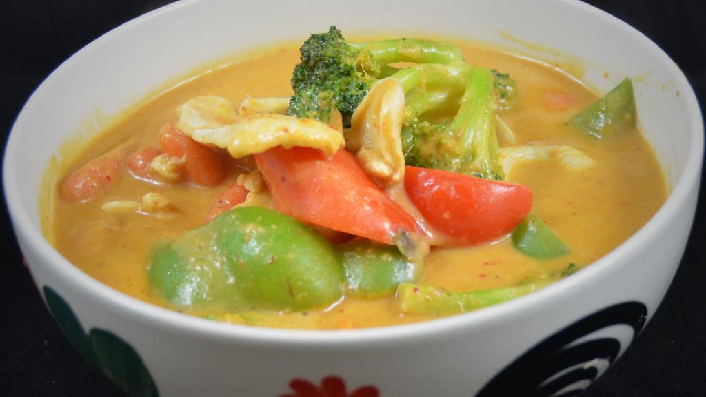 #30 Peanut Curry:* (Vg) · Homemade peanut sauce and delicious red curry with bell pepper, carrots, broccoli, and your choice of protein.