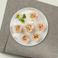Chinese Dumpling (Shumai) (4 Pcs) · Steamed house-made dumplings filled with shrimp, chicken, shiitake mushrooms, and water ches...
