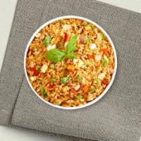 Thai Fried Rice · Stir-fried rice with egg, tomatoes, carrots, onions, and peas, topped with chopped cilantro ...