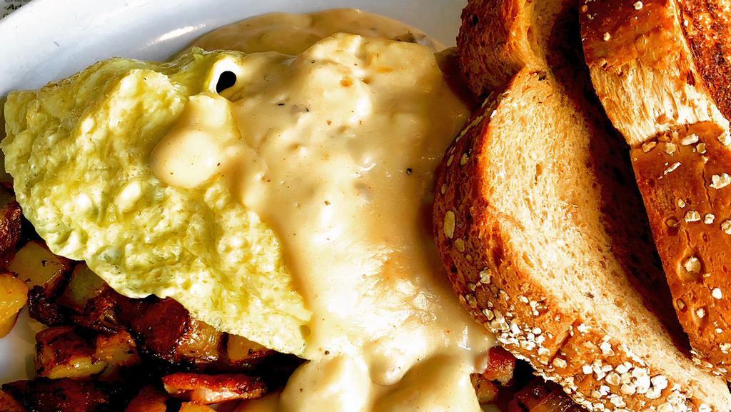 Cricket Omelet · Four egg omelet with pepper bacon, onions, cheddar & home fries inside, topped with pork sausage gravy. Served with toast. (sub vegetarian sausage and vegan gravy on request. ).