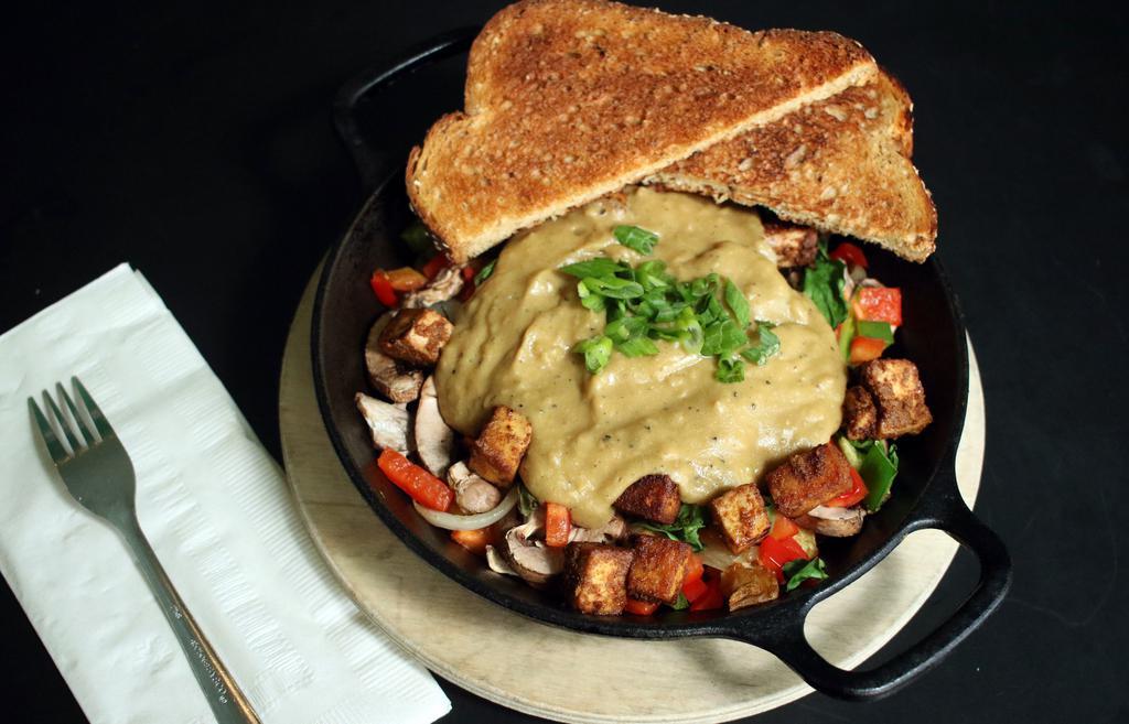 Portland · Baked tofu, roasted potatoes, spinach, mushrooms, bell peppers, & onions. Topped with house vegan gravy & green onions. Served with toast. Vegan.