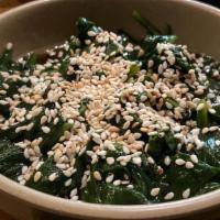 Spinach Salad · Boiled spinach mixed with sweet soy sauce and sesame oil, topped with sesame seeds.