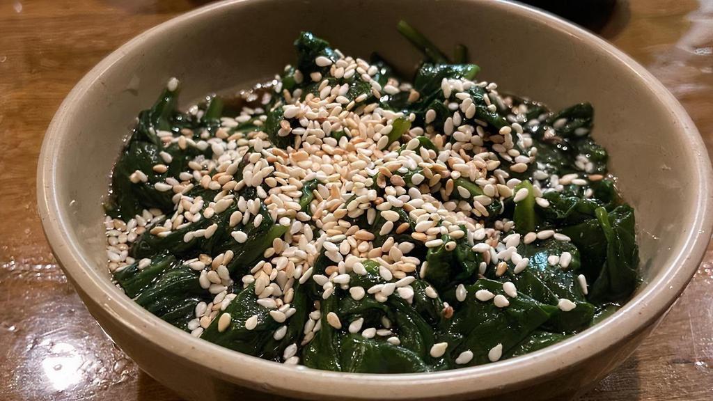 Spinach Salad · Boiled spinach mixed with sweet soy sauce and sesame oil, topped with sesame seeds.