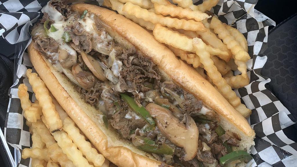 Philly Cheesesteak · Mushroom, bell peppers, onions, And choice of cheese provolone or pepper jack with fries.