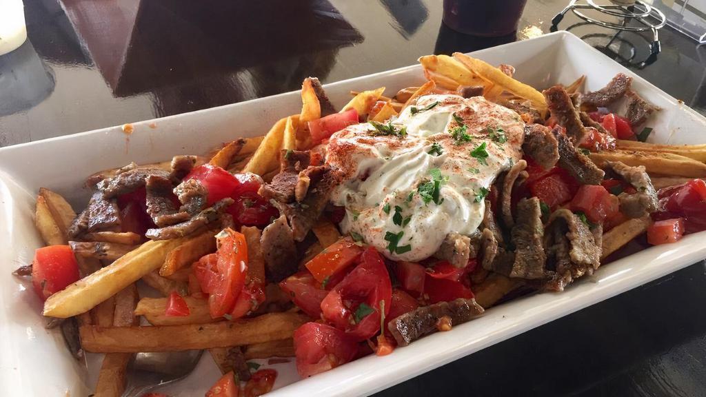 Greek (Gyro) Fries · gyro meat, fresh tomato, and crumbled feta with side tzatziki.