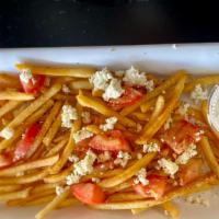 Feta Tomato Fries · crumbled feta, fresh tomato, drizzled olive oil, and tzatziki.