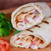 Shawarma Wrap · Tender Chicken Shawarma wrap filled with lettuce, tomatoes, pickles and our signature Shawar...