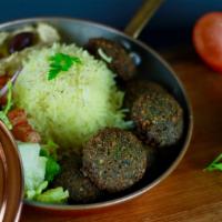 Falafel Plate · Crispy Falafel pieces served with basmati rice, salad and our homemade Hummus