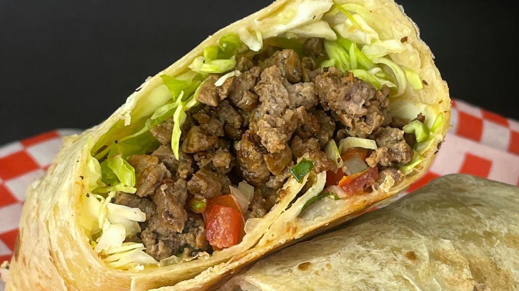 Carne Asada Burrito · Carne asada, pico de gallo, cabbage and avocado