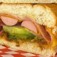 Cubana Torta · sandwich filled with pork, refried beans, onions, tomatoes, chicken hotdogs, cheese, sliced ...