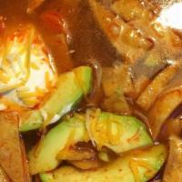Tortilla Soup · Chicken, vegetables, and tortilla strips in a rich broth served with rice, cheese, and sour ...