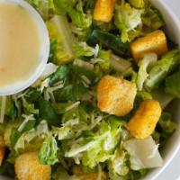 Caesar Salad · Romaine lettuce topped with croutons, pico de gallo, and cheese. Served with classic caesar ...