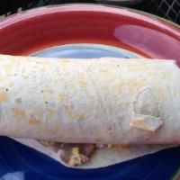 Breakfast Burrito · Two freshly scrambled eggs with cheese, tomatoes, onions, cilantro, and beans wrapped in a l...