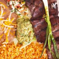 Carne Asada · Popular. Hand-cut steak marinated and grilled to perfection, topped with green onion, fried ...