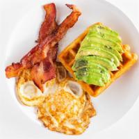 Breakfast Plate · Two eggs, two pieces of thick applewood bacon, sliced avocado and a crispy flaky croissant w...