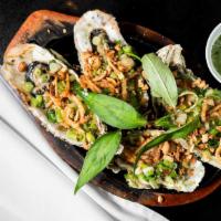 Hào Nướng Mỡ Hành · Grilled oysters with green onion.
