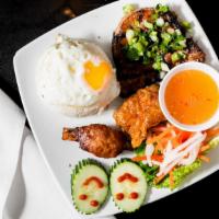 Cơm Tấm Đặc Biệt · Special broken rice dish (grilled pork chop, prawn sugar cane, fried egg, and fried bean cur...